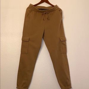 Tan sweatpants with oversized pockets